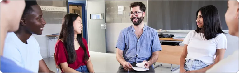 people having aa meeting in recovery center