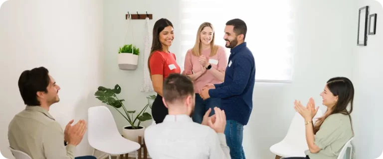 people having aa meeting in recovery center