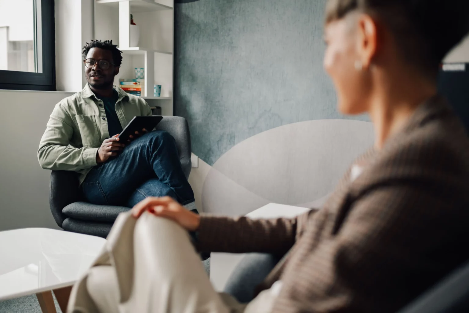 people having aa meeting in recovery center